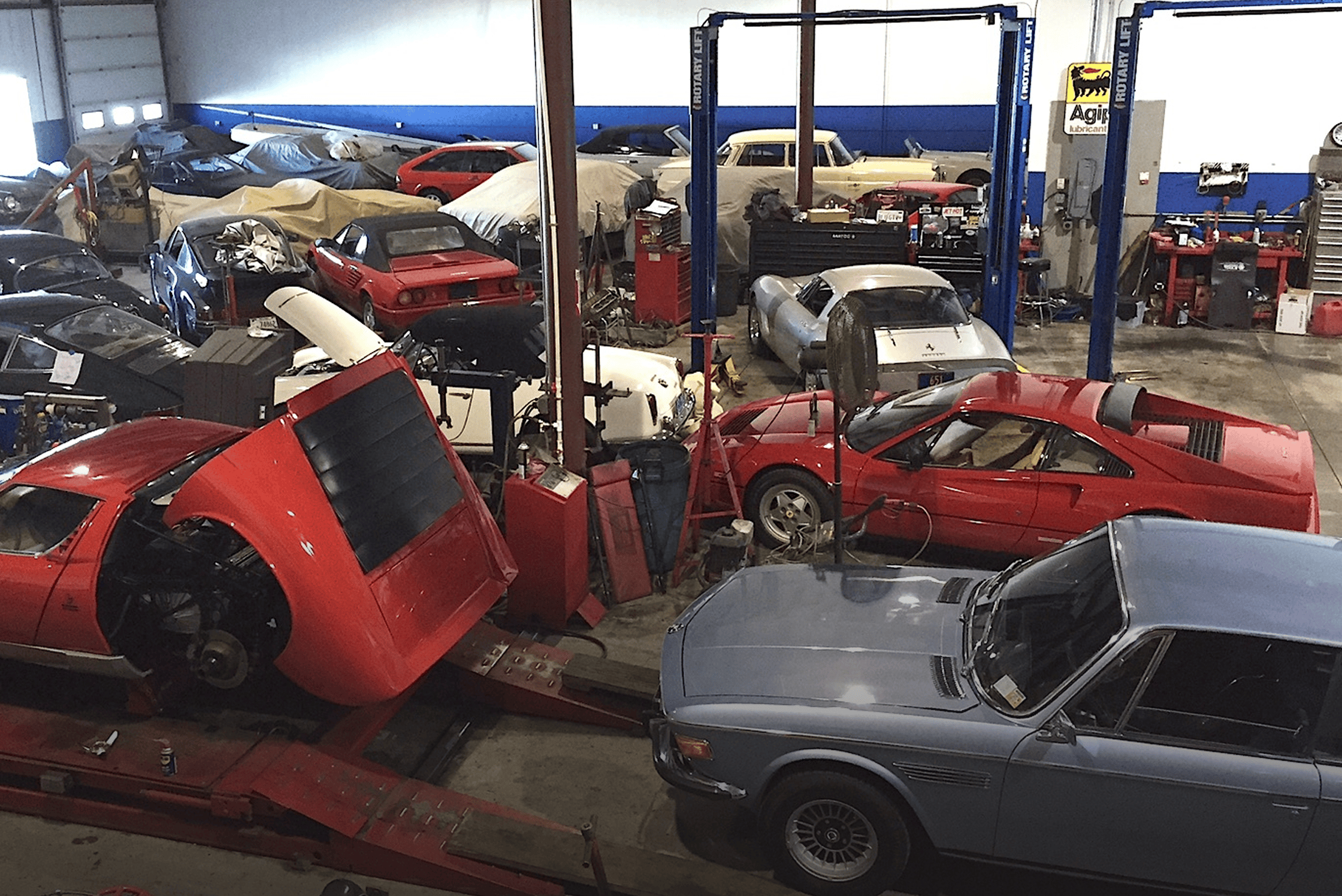 Automotive repair shop filled with classic cars